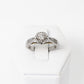 Anillo de Compromiso en Oro Blanco 14k con Diamantes Laterales y Halo